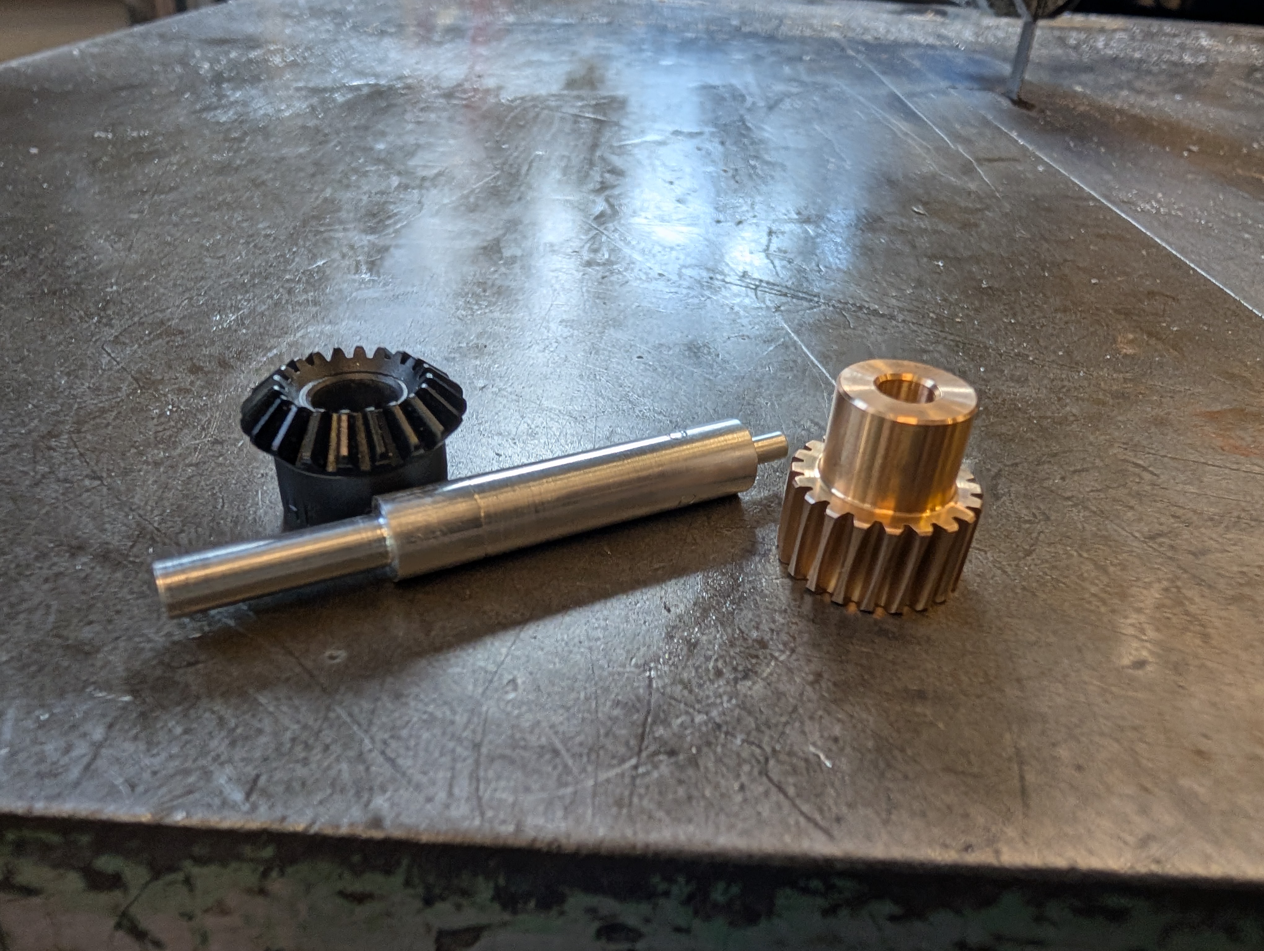 Machined and printed shaft components for the mechanism